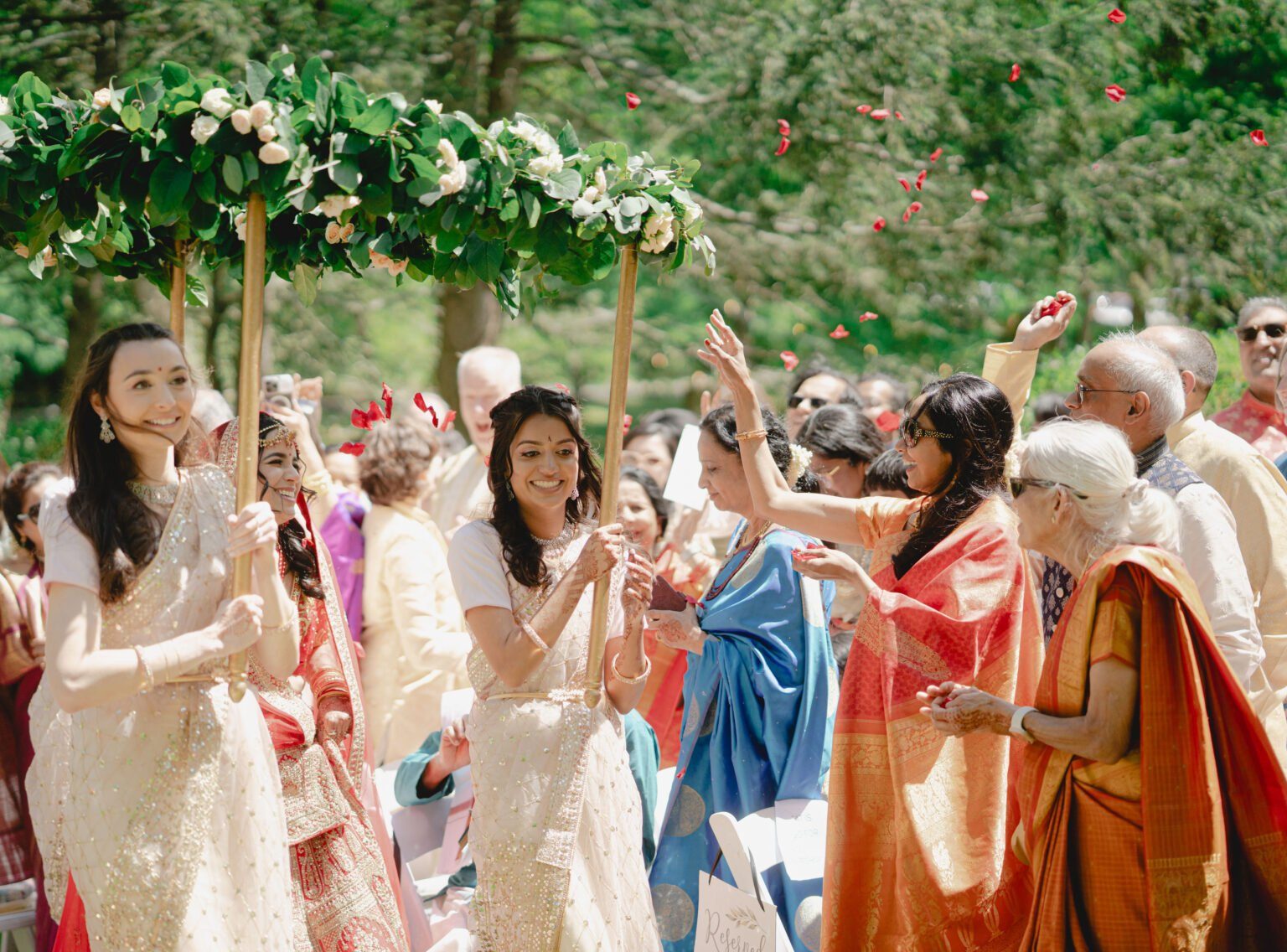 Joyful baraat procession with flower toss