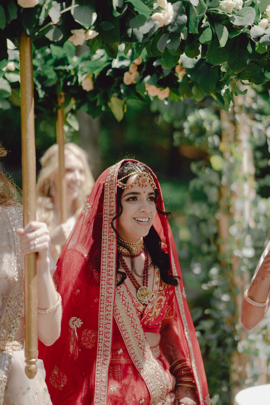 Bride beneath a floral phoolon ki chadar